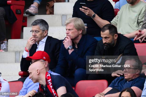 President Herbert Hainer, CEO Oliver Kahn of Bayern, Sporting Director Hasan Salihamidzic react after first goal for Mainz 05 during the Bundesliga...