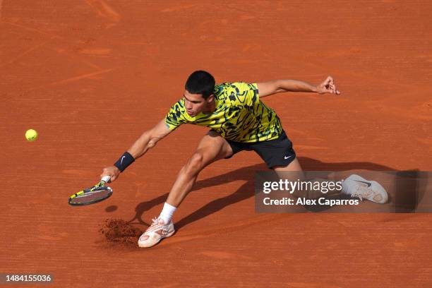 Carlos Alcaraz of Spain plays a backhand against Dan Evans of Great Britain during the semi-final match on day six of the Barcelona Open Banc...