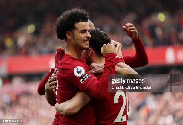 Diogo Jota of Liverpool celebrates with teammate Curtis Jones after scoring the team's first goal during the Premier League match between Liverpool...
