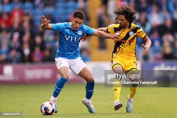 Kyle Knoyle of Stockport County is challenged by D'Mani Mellor of Rochdale during the Sky Bet League Two between Stockport County and Rochdale at...