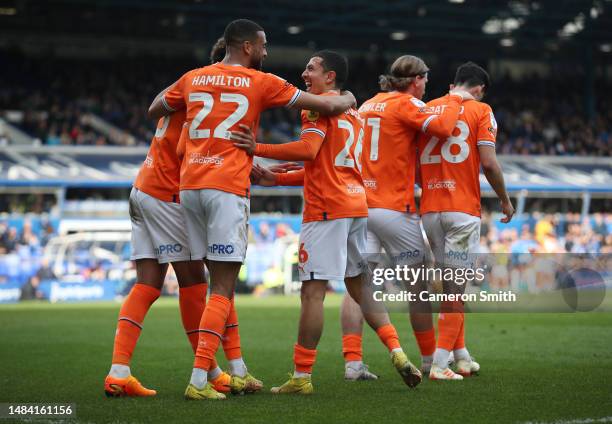 Ian Poveda of Blackpool celebrates with teammates after scoring the team's first goal during the Sky Bet Championship between Birmingham City and...