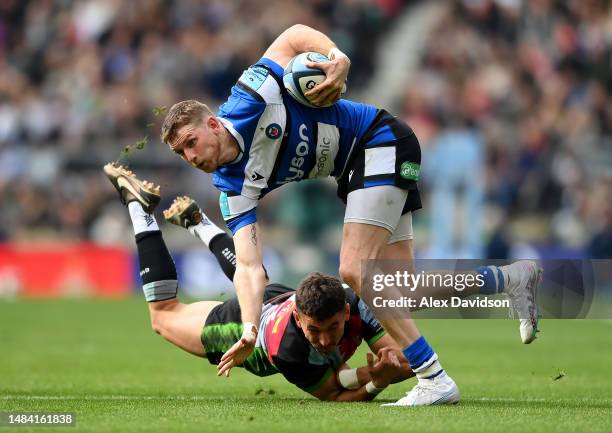 Ruaridh McConnochie of Bath is tackled by Nick David of Harlequins during the Gallagher Premiership Rugby match between Harlequins and Bath Rugby at...