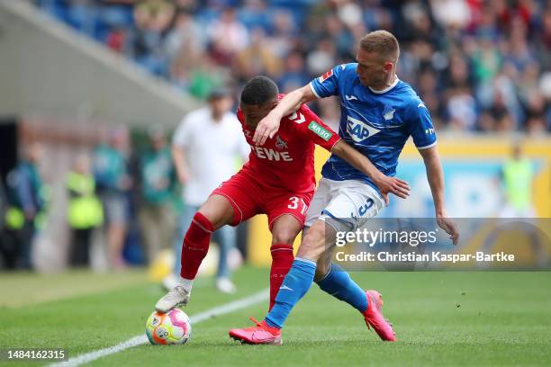 Linton Maina of 1.FC Koeln and Pavel Kaderabek of TSG Hoffenheim battle for the ball during the Bundesliga match between TSG Hoffenheim and 1. FC...