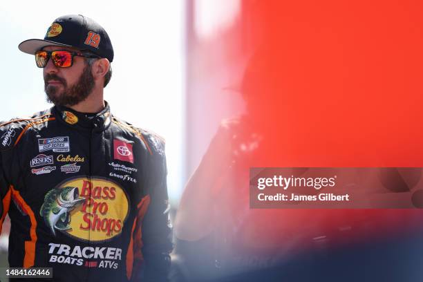 Martin Truex Jr., driver of the Bass Pro Shops Toyota, looks on during qualifying for the NASCAR Cup Series GEICO 500 at Talladega Superspeedway on...