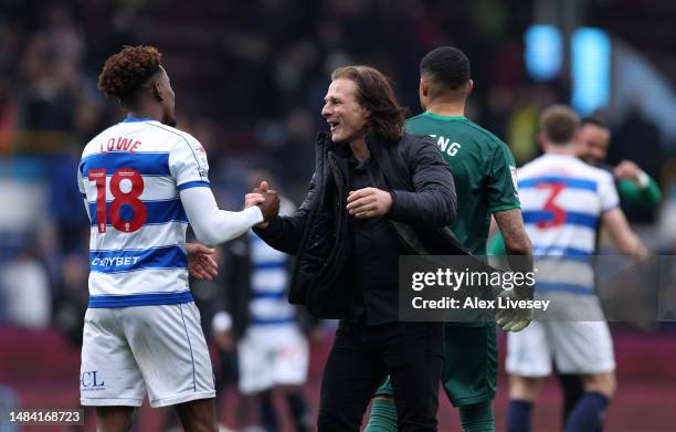 Gareth Ainsworth the manager of Queens Park Rangers celebrates with Jamal Lowe after the Sky Bet Championship between Burnley and Queens Park Rangers...