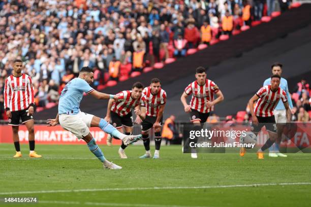 Riyad Mahrez of Manchester City scores the team's first goal from the penalty spot during the FA Cup Semi Final match between Manchester City and...