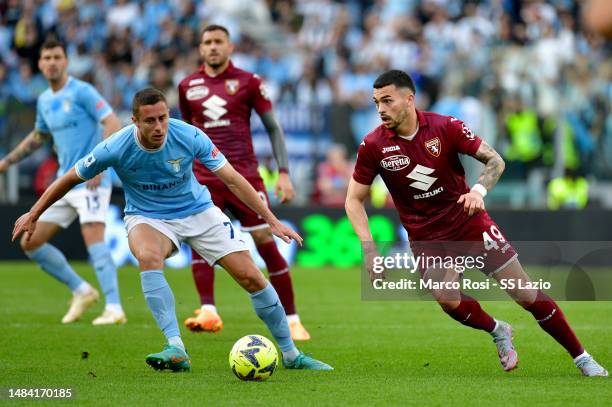 Adam Marusic of SS Lazio compete for the ball with Nemanja Radonjic of Torino FC during the Serie A match between SS Lazio and Torino FC at Stadio...