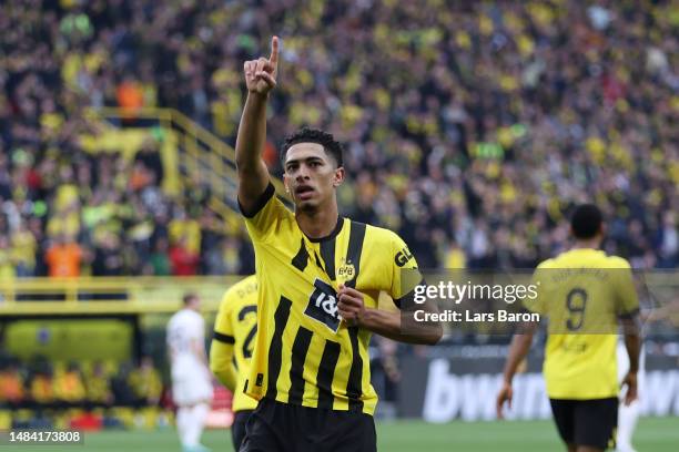 Jude Bellingham of Borussia Dortmund celebrates after scoring the team's first goal during the Bundesliga match between Borussia Dortmund and...