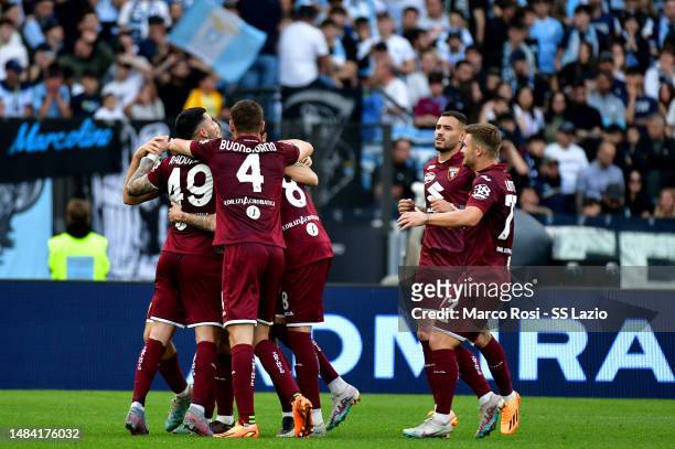 Ivan Ilic of Torino FC celebrates a opening goal with his team mates during the Serie A match between SS Lazio and Torino FC at Stadio Olimpico on...