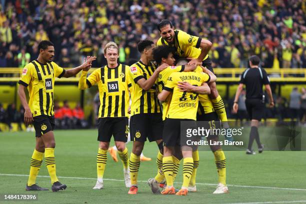 Mats Hummels of Borussia Dortmund celebrates with teammates after scoring the team's third goal during the Bundesliga match between Borussia Dortmund...