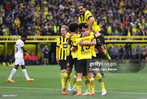 Mats Hummels of Borussia Dortmund celebrates with teammates after scoring the team's third goal during the Bundesliga match between Borussia Dortmund...