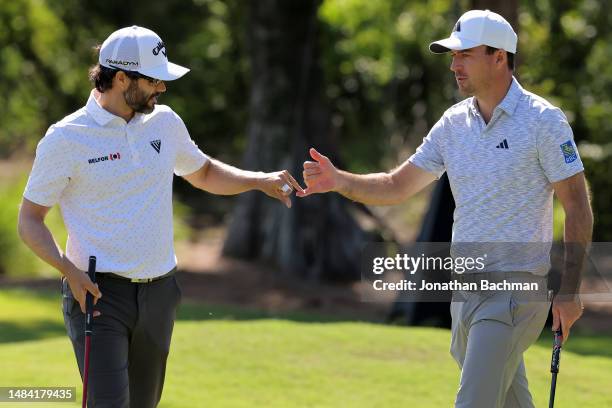 Adam Hadwin of Canada and Nick Taylor of Canada react on the fourth green during the third round of the Zurich Classic of New Orleans at TPC...