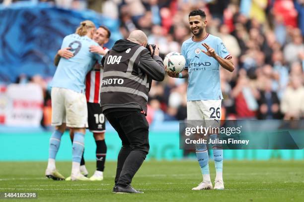 Riyad Mahrez of Manchester City poses for a photo with the match ball after their hat-trick during the FA Cup Semi Final match between Manchester...