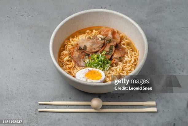 asian instant noodle with pork on gray background - instant noodles stock pictures, royalty-free photos & images