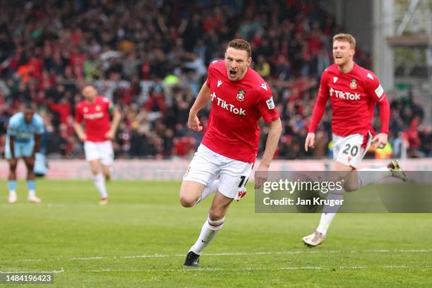 Paul Mullin of Wrexham celebrates after scoring the team's second goal during the Vanarama National League match between Wrexham and Boreham Wood at...