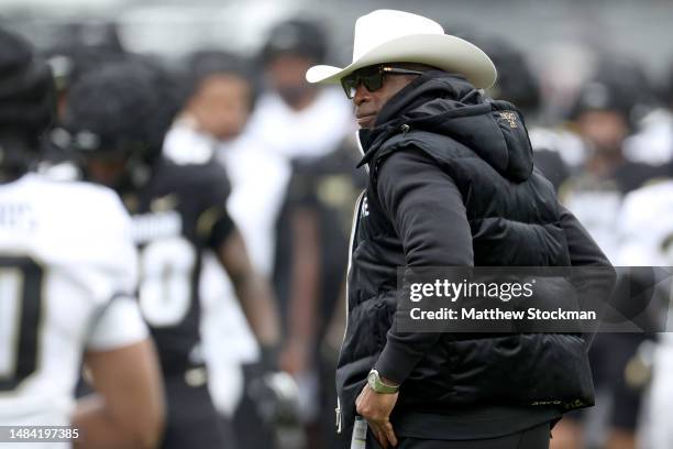 Head coach Deion Sanders of the Colorado Buffaloes watches as his team warms up prior to their spring game at Folsom Field on April 22, 2023 in...