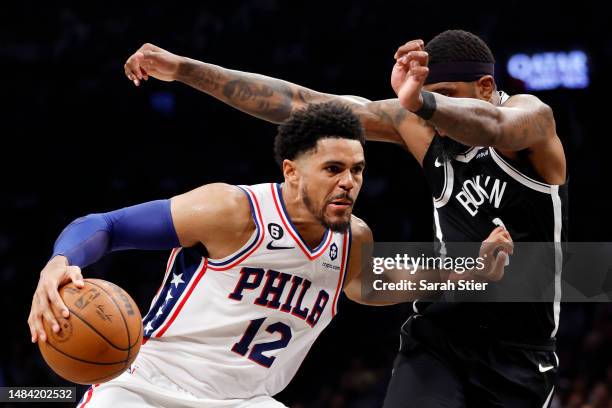 Tobias Harris of the Philadelphia 76ers dribbles against Royce O'Neale of the Brooklyn Nets during the second half of Game Four of the Eastern...