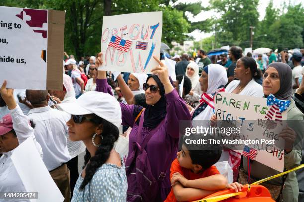 Rockville, MD Sarah Aljerjawi center, of Germantown participates in the protest. She has four children in Montgomery County Public Schools. A large...