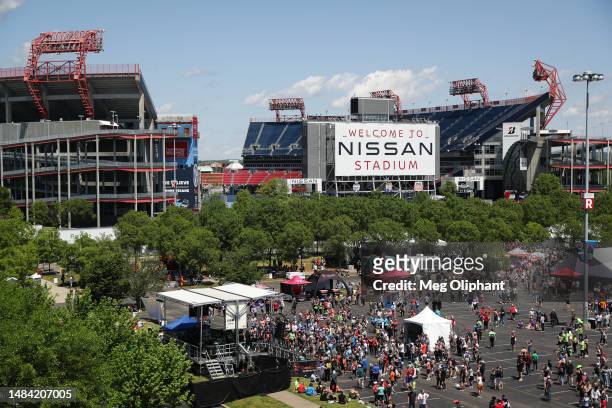 Runners participate in the finish line festival outside of Nissan Stadium after completing the Rock 'n' Roll marathon on April 22, 2023 in Nashville,...