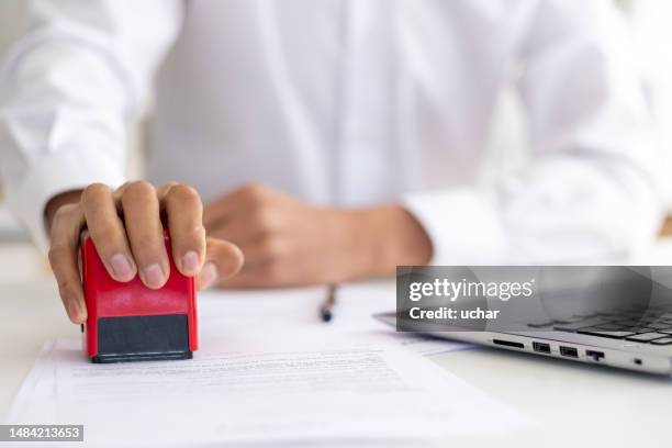 businessman using red stamp - agree stock pictures, royalty-free photos & images