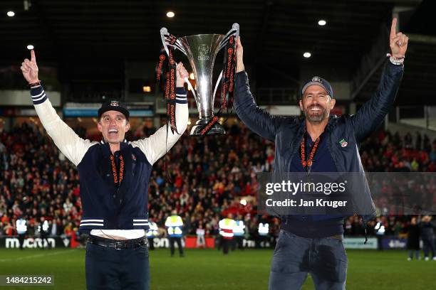 Rob McElhenney and Ryan Reynolds, Owners of Wrexham celebrate with the Vanarama National League trophy as Wrexham win the Vanarama National League...