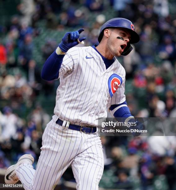 Nico Hoerner of the Chicago Cubs celebrates a two run home run during the seventh inning of the game against the Los Angeles Dodgers at Wrigley Field...