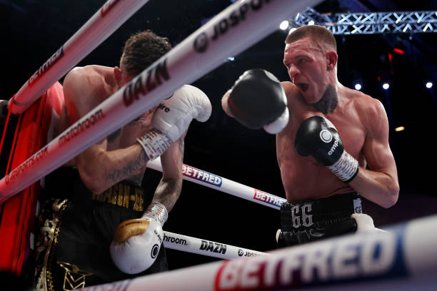 Gavin Gwynne punches Craig Woodruff during the British Lightweight Title fight between Gavin Gwynne and Craig Woodruff at Motorpoint Arena Cardiff on...
