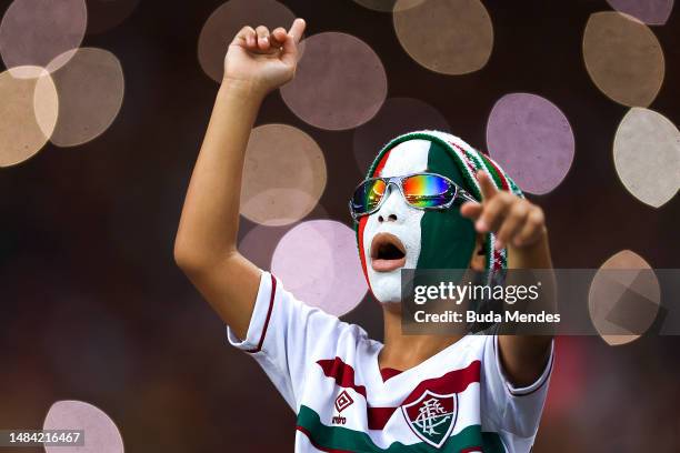Young fan of Fluminense cheers during the match between Fluminense and Athletico Paranaense as part of Brasileirao 2023 at Maracana Stadium on April...