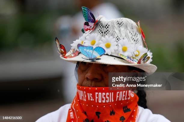 People attend an Earth Day gathering titled “End the Era of Fossil Fuels,” at Freedom Plaza on April 22, 2023 in Washington, DC. Activists with...