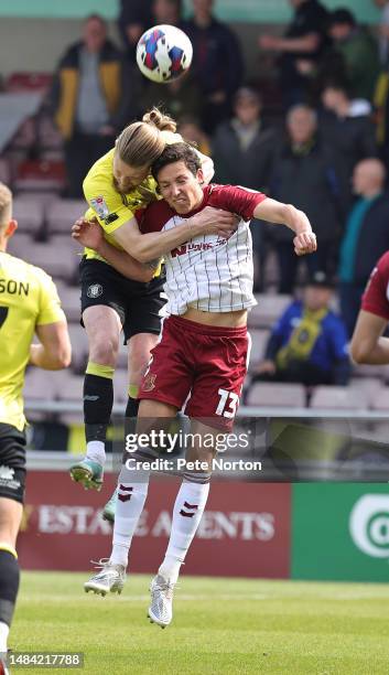 Luke Armstrong of Harrogate Town contests the ball with David Norman Jr of Northampton Town during the Sky Bet League Two between Northampton Town...