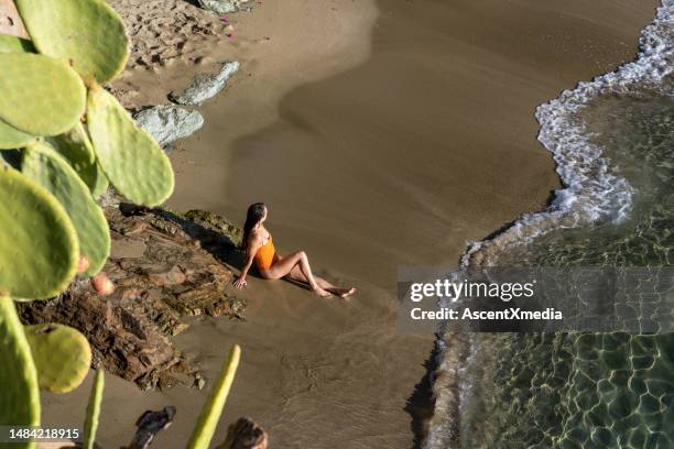 woman on a stunning beach in agia pelagia, crete - heraklion stock pictures, royalty-free photos & images