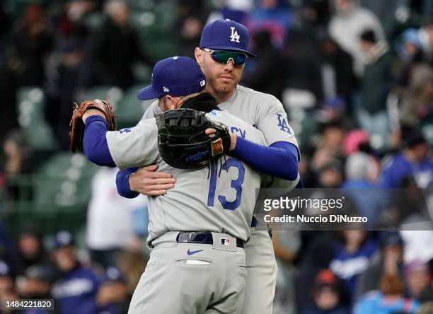 Max Muncy of the Los Angeles Dodgers is hugged by Freddie Freeman at the end of their team win over the Chicago Cubs at Wrigley Field on April 22,...