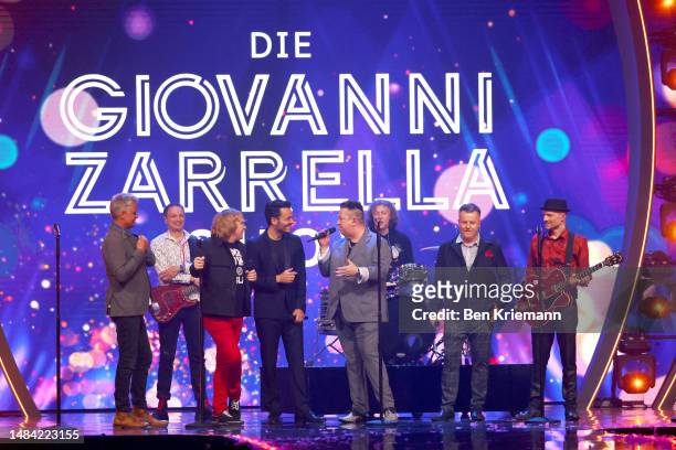 Giovanni Zarrella and german band Die Prinzen speak on stage during the Giovanni Zarrella show at Studio Berlin Adlershof on April 22, 2023 in...