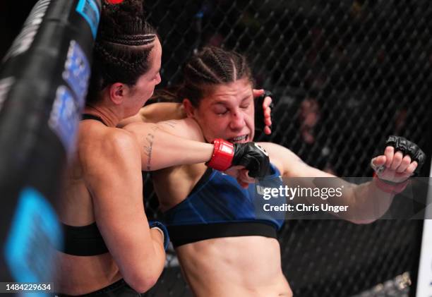 Karol Rosa of Brazil elbows Norma Dumont of Brazil in a featherweight fight during the UFC Fight Night event at UFC APEX on April 22, 2023 in Las...