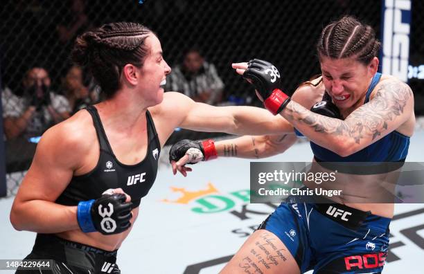 Norma Dumont of Brazil punches Karol Rosa of Brazil in a featherweight fight during the UFC Fight Night event at UFC APEX on April 22, 2023 in Las...