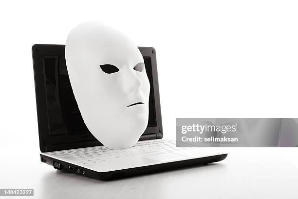 white mask on computer for internet security concept - con man 個照片及圖片檔