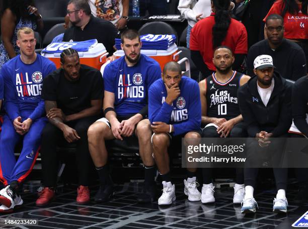 Mason Plumlee, Kawhi Leonard, Ivica Zubac, Nicolas Batum, Eric Gordon and Paul George of the LA Clippers watch play during a 112-100 loss to the...