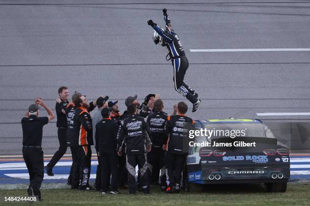 Jeb Burton, driver of the Solid Rock Carriers Chevrolet, and crew celebrate after winning the NASCAR Xfinity Series Ag-Pro 300 at Talladega...