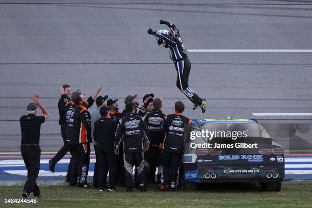 Jeb Burton, driver of the Solid Rock Carriers Chevrolet, and crew celebrate after winning the NASCAR Xfinity Series Ag-Pro 300 at Talladega...