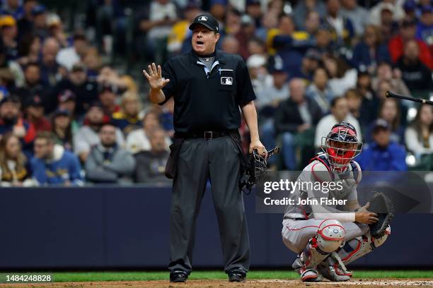 Umpire Doug Eddings warns the Brewers bench in the second inning of the game between the Boston Red Sox and the Milwaukee Brewers at American Family...