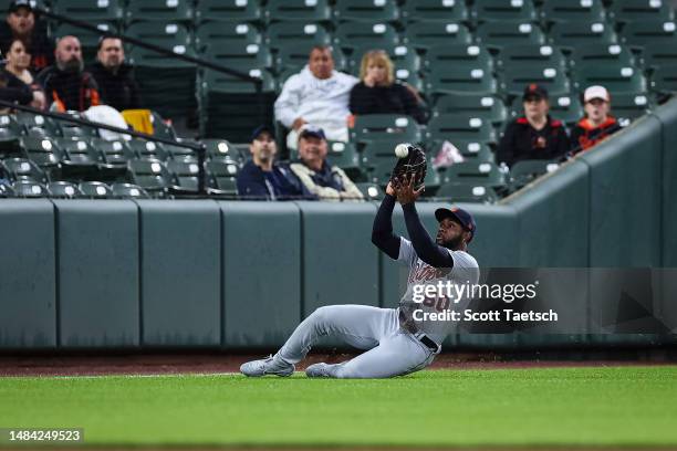 Akil Baddoo of the Detroit Tigers makes a sliding catch to retire Anthony Santander of the Baltimore Orioles during the first inning at Oriole Park...