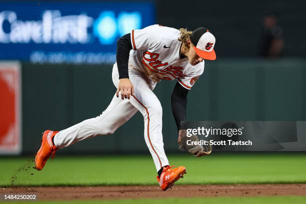 Gunnar Henderson of the Baltimore Orioles fields a ground ball hit by Javier Baez of the Detroit Tigers during the third inning at Oriole Park at...