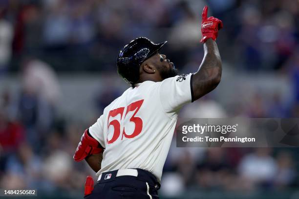 Adolis Garcia of the Texas Rangers celebrates after hitting a two-run home run against Adrian Martinez of the Oakland Athletics in the bottom of the...