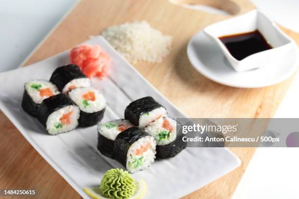 high angle view of sushi served in plate on table,romania - fresh wasabi stock-fotos und bilder