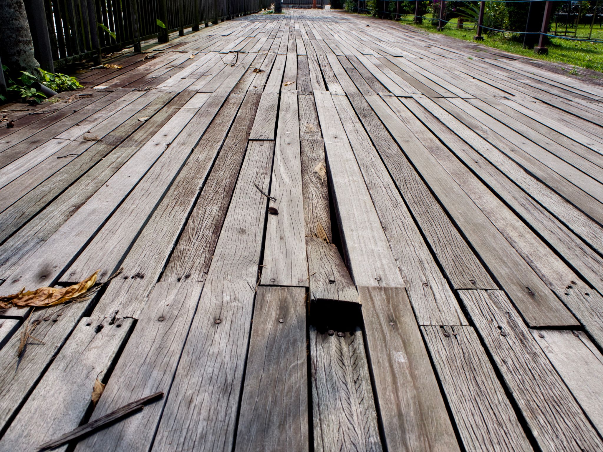 Damaged outdoor wooden plank at Changi Broadwalk Damaged outdoor wooden plank at Changi Broadwalk