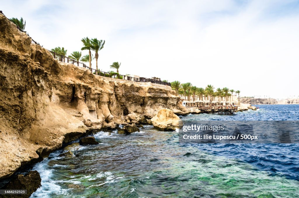 View from the sea to a rocky beach and a reef on the Red Sea coast