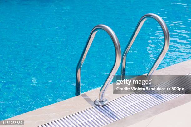 high angle view of swimming pool - piscina pubblica foto e immagini stock