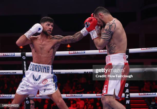 Boxers Shavkatdzhon Rakhimov and Joe Cordina in action for the IBF World Super Featherweight title at the Motorpoint Arena Cardiff on April 22, 2023...