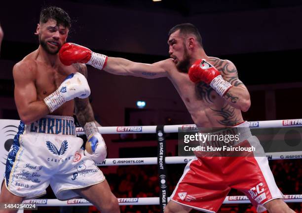 Boxers Shavkatdzhon Rakhimov and Joe Cordina in action for the IBF World Super Featherweight title at the Motorpoint Arena Cardiff on April 22, 2023...