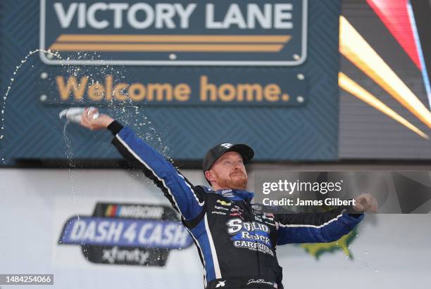 Jeb Burton, driver of the Solid Rock Carriers Chevrolet, celebrates in victory lane after winning the NASCAR Xfinity Series Ag-Pro 300 at Talladega...